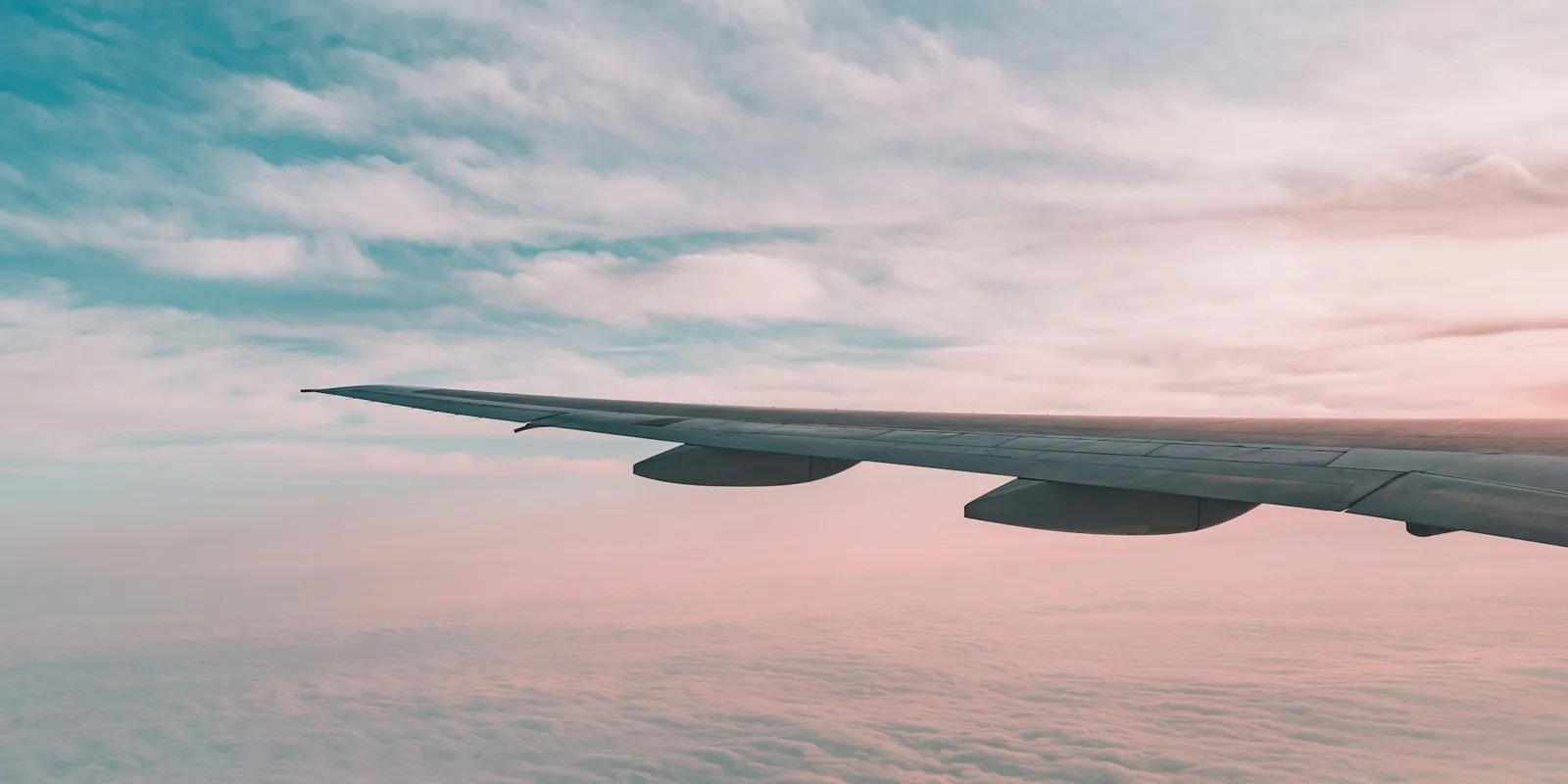 A plane's wing above the clouds