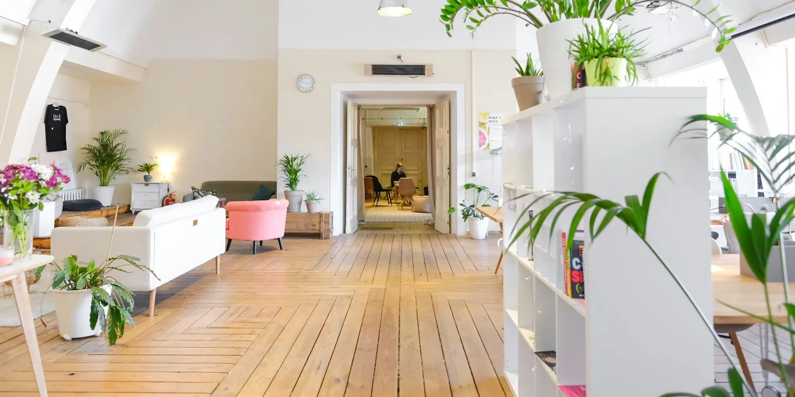 A bright, calm room set up as a workspace